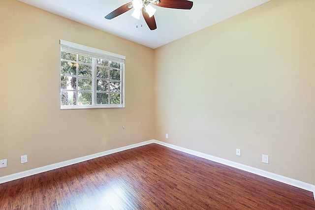 unfurnished room featuring ceiling fan and dark hardwood / wood-style floors