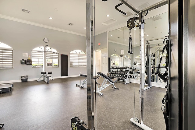 gym featuring a high ceiling and crown molding