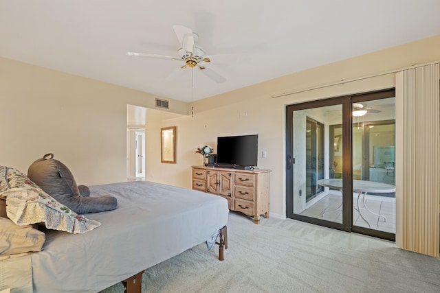 carpeted bedroom featuring access to exterior and ceiling fan