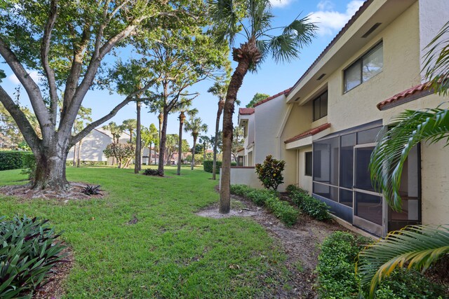 view of yard with a sunroom