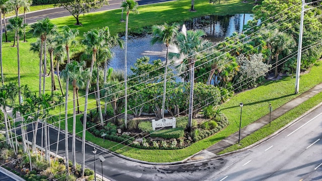 birds eye view of property with a water view