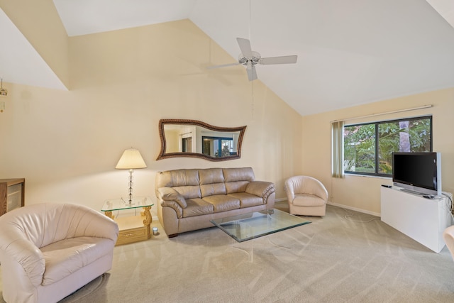 carpeted living room with ceiling fan and high vaulted ceiling