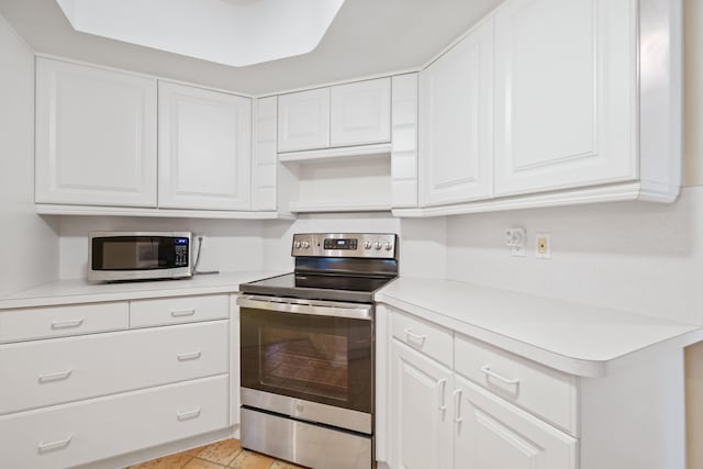 kitchen with white cabinetry and appliances with stainless steel finishes