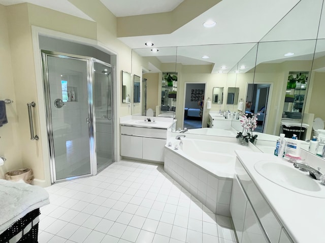 bathroom with vanity, independent shower and bath, and tile patterned floors