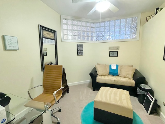 office area featuring light colored carpet and ceiling fan