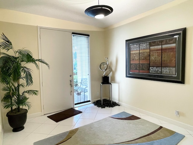 entrance foyer with light tile patterned floors