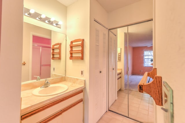 bathroom with tile patterned floors and vanity