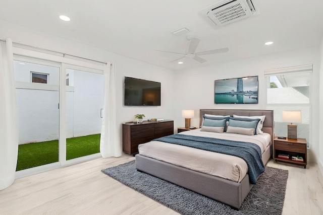 bedroom featuring ceiling fan, light wood-type flooring, and access to outside