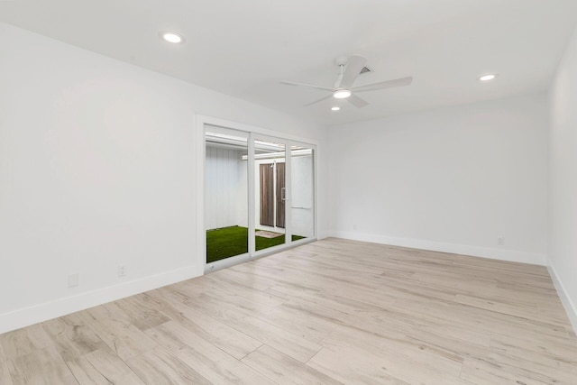 spare room with light hardwood / wood-style floors and ceiling fan