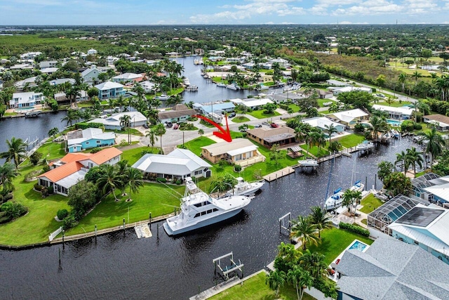 birds eye view of property featuring a water view