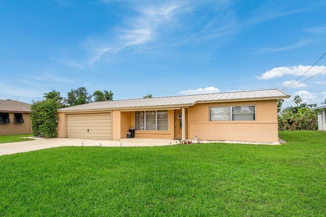 rear view of house with a lawn