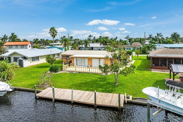 dock area featuring a yard and a water view