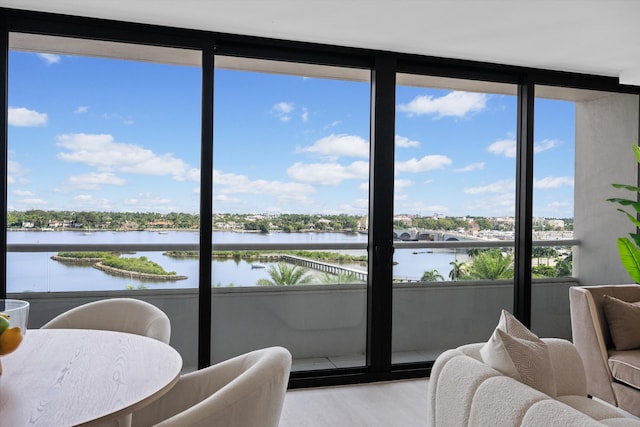 sunroom / solarium with a water view