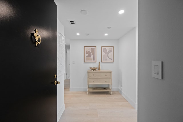 hallway with light wood-type flooring