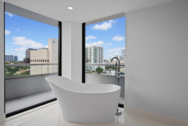 bathroom featuring a wealth of natural light and a washtub