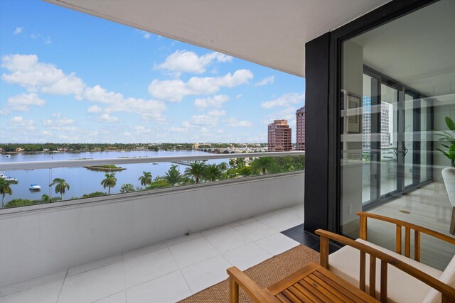 balcony featuring a water view