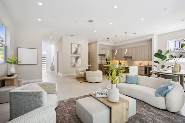 living room with recessed lighting, wine cooler, and baseboards