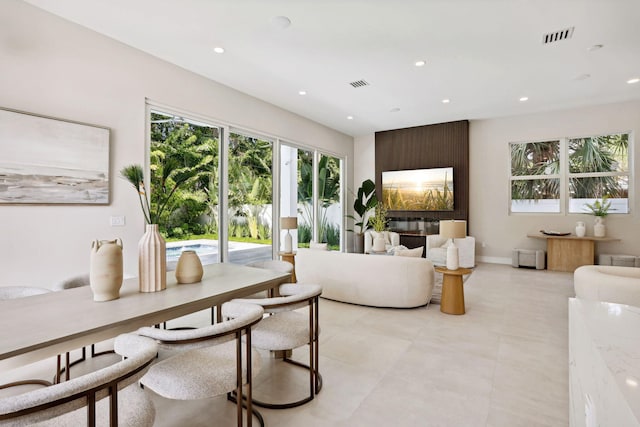 living area with recessed lighting and baseboards