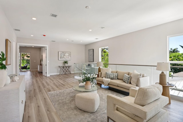 living room with light hardwood / wood-style floors