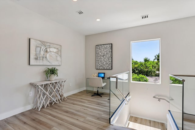 home office featuring light wood-style flooring, baseboards, and recessed lighting