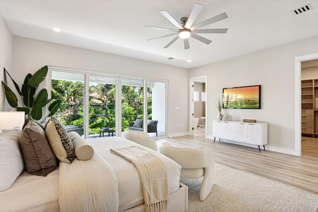bedroom with baseboards, light wood-type flooring, access to outside, recessed lighting, and a ceiling fan