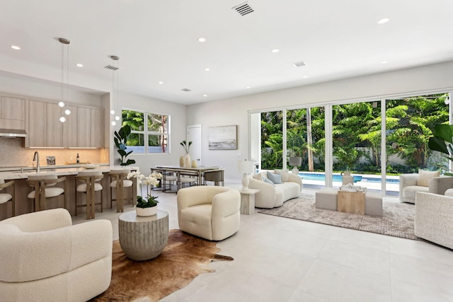 living area featuring recessed lighting and light tile patterned flooring