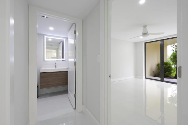 hallway with light tile patterned floors