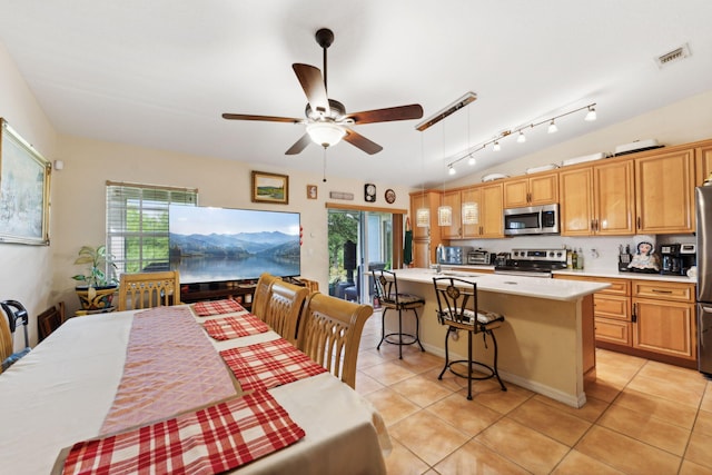 dining room with light tile patterned floors and a notable chandelier