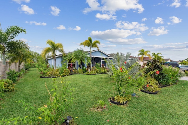 view of front of house featuring a front yard and a garage