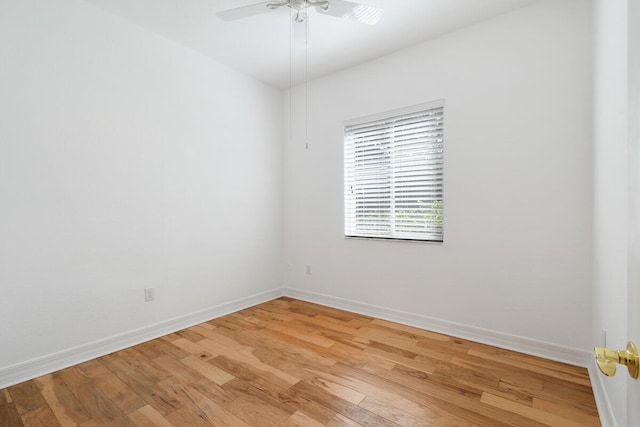 spare room featuring light hardwood / wood-style flooring and ceiling fan