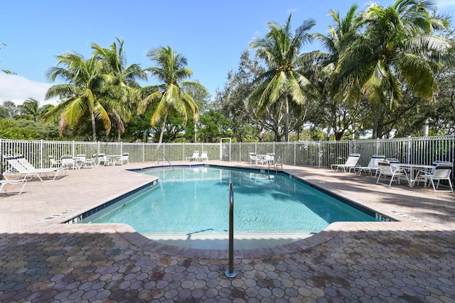 view of swimming pool featuring a patio area