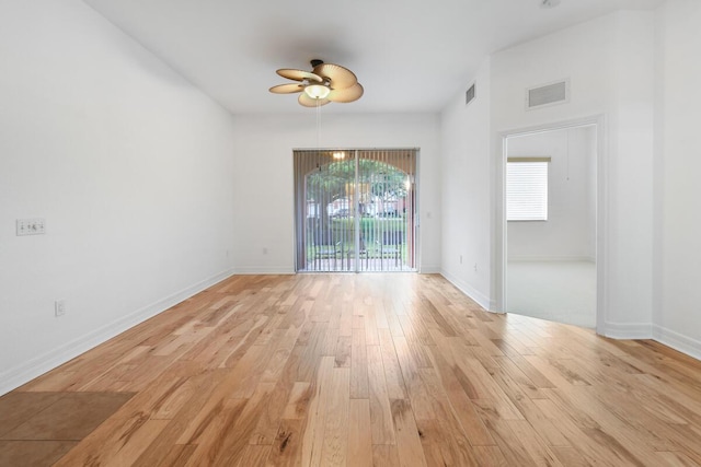 unfurnished room featuring ceiling fan, a healthy amount of sunlight, and light wood-type flooring