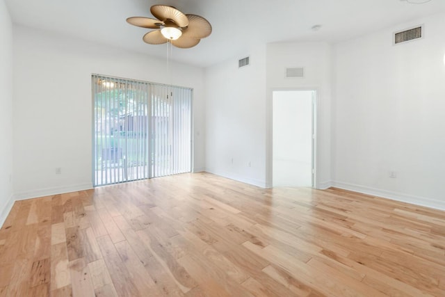 empty room featuring ceiling fan and light wood-type flooring