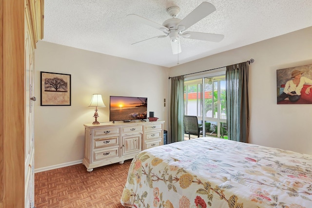 bedroom featuring ceiling fan, access to outside, a textured ceiling, and light parquet floors