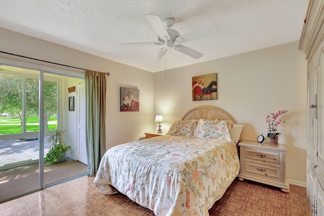 bedroom featuring a textured ceiling, access to exterior, parquet floors, and ceiling fan