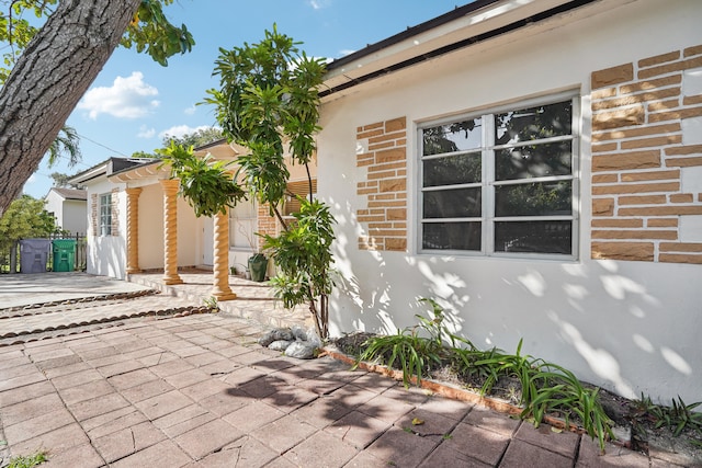 view of side of property featuring a patio