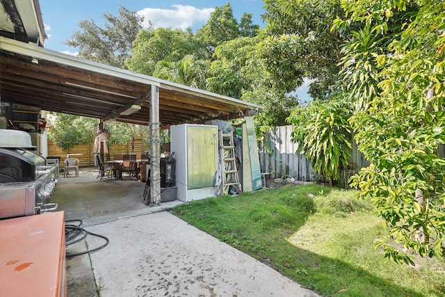 view of patio with a grill