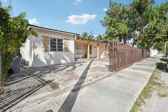 ranch-style home with cooling unit