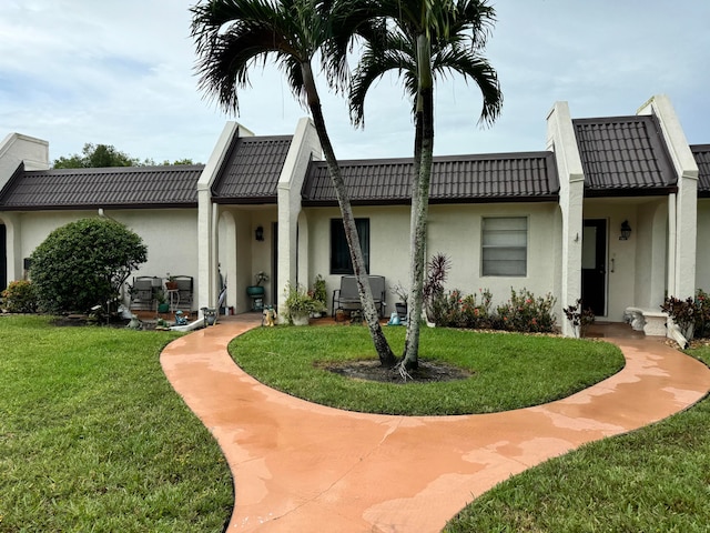 view of front of home with a front yard