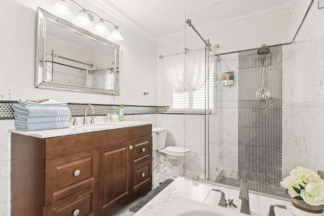 bathroom with a shower with door, tile walls, vanity, ornamental molding, and toilet