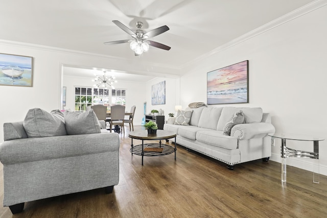 living room featuring ornamental molding, dark hardwood / wood-style floors, and ceiling fan with notable chandelier