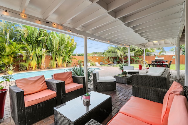 view of patio with a fenced in pool and outdoor lounge area