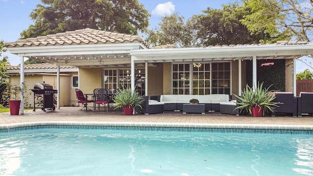 rear view of house with an outdoor hangout area and a patio