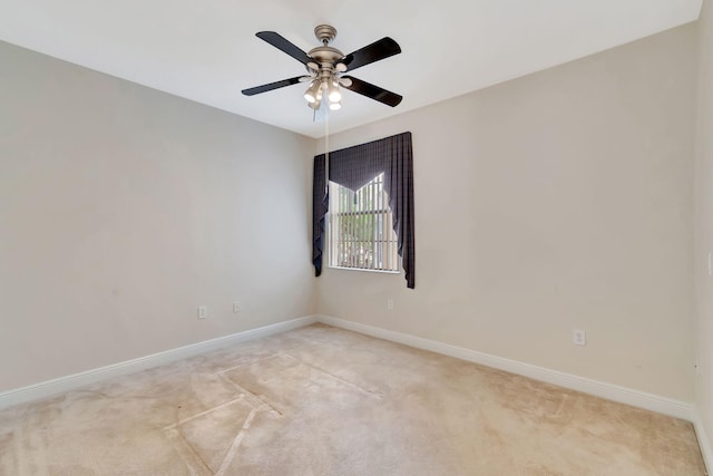 empty room with light carpet and ceiling fan