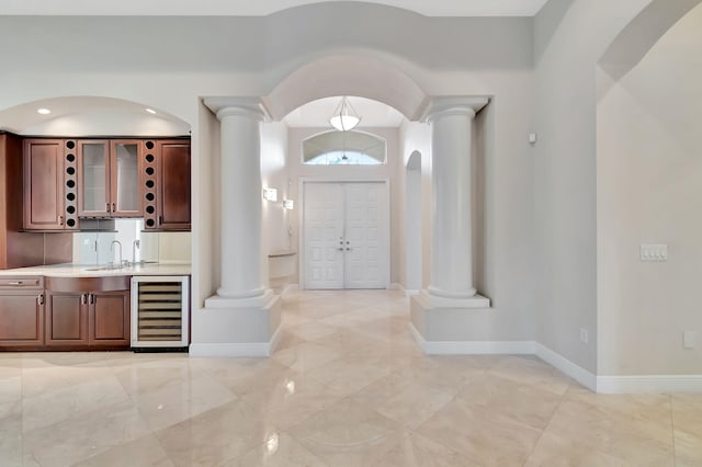 foyer with sink and beverage cooler