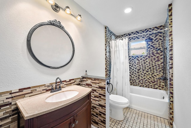 full bathroom featuring tile patterned floors, decorative backsplash, toilet, shower / bath combination with curtain, and vanity