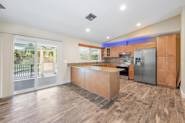 kitchen with stainless steel appliances, wood-type flooring, vaulted ceiling, and kitchen peninsula