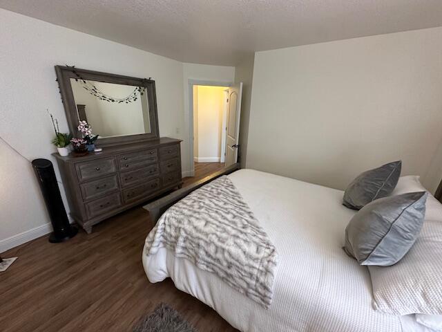 bedroom featuring dark hardwood / wood-style floors