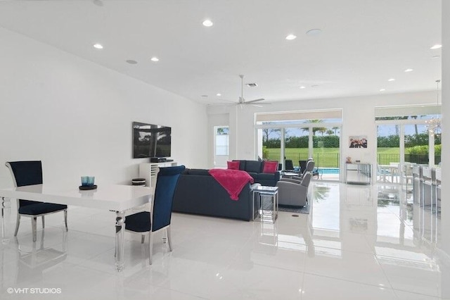 living room with light tile patterned floors and ceiling fan