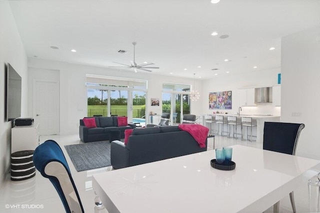 dining room featuring sink and ceiling fan